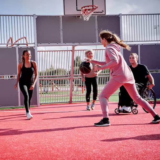 people playing basket on a multi use games area