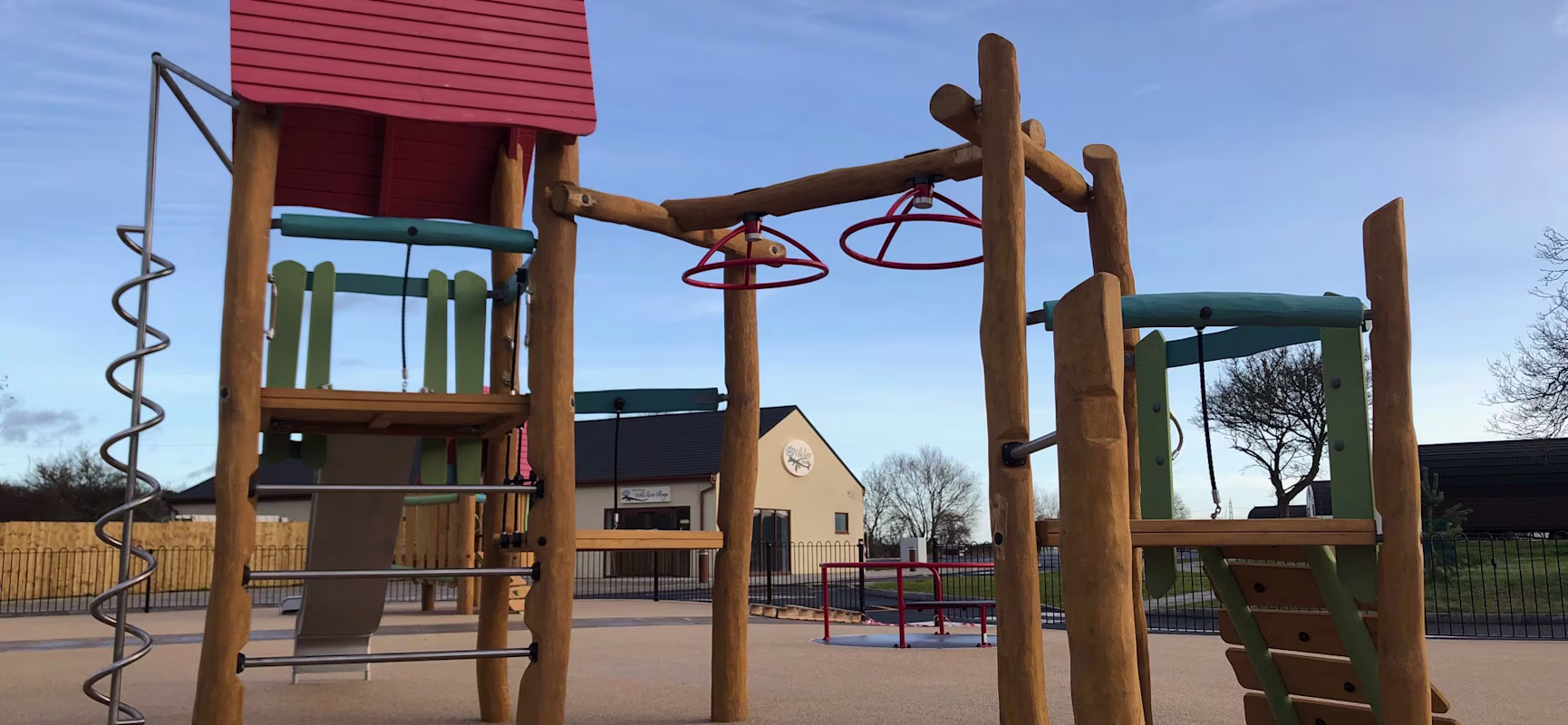 Wooden playground structure with climbing options