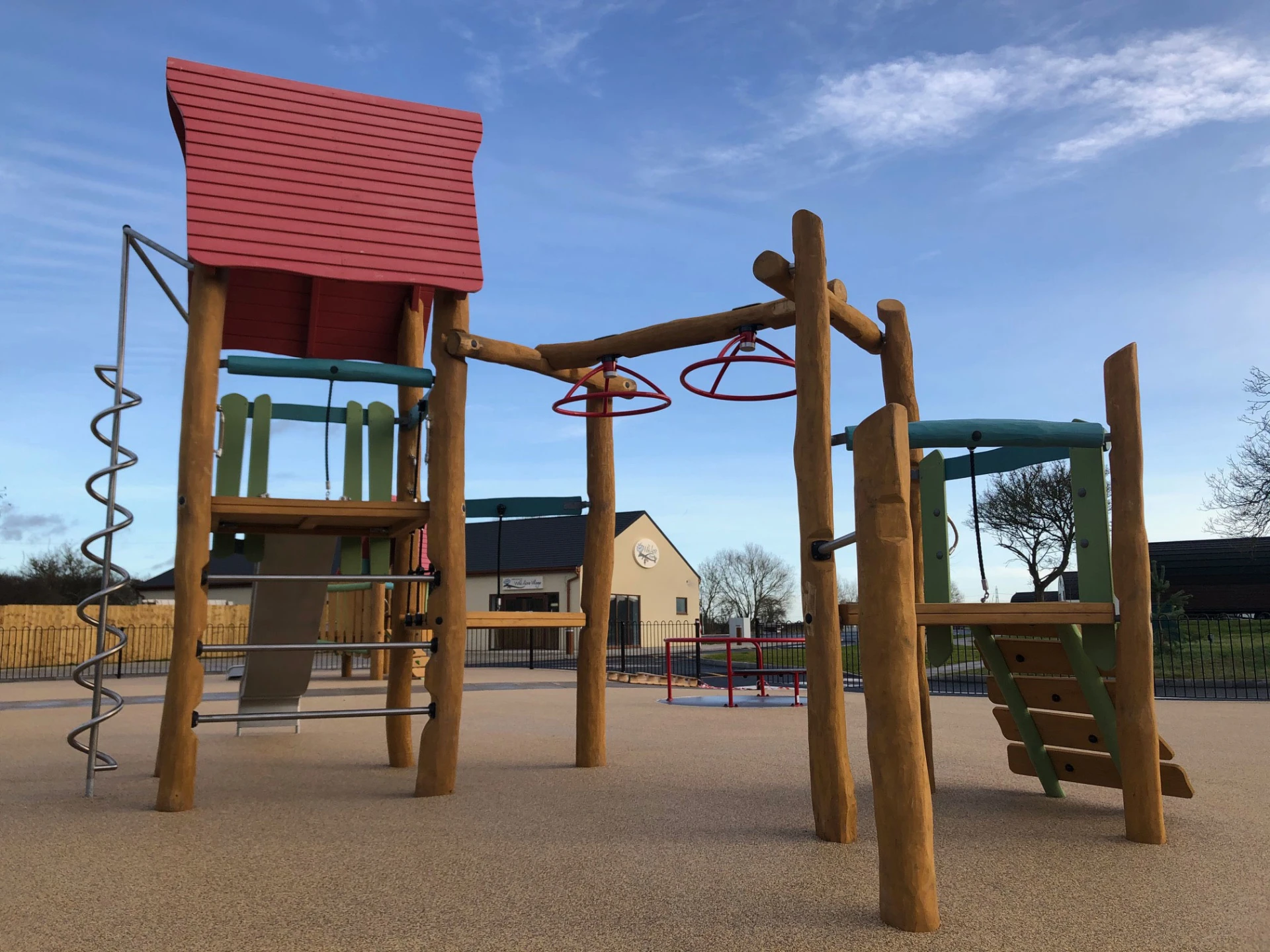 Wooden playground structure with climbing options