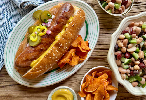three bean salad with onions and pepper in white and blue bowl