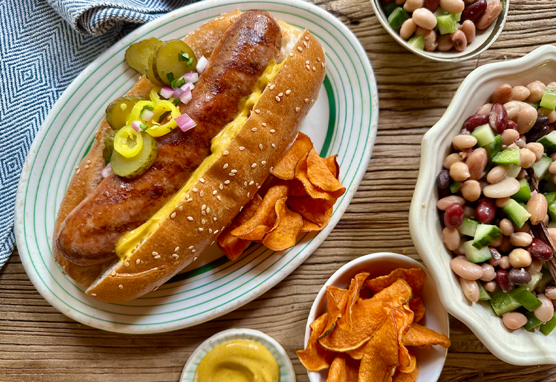 three bean salad with onions and pepper in white and blue bowl