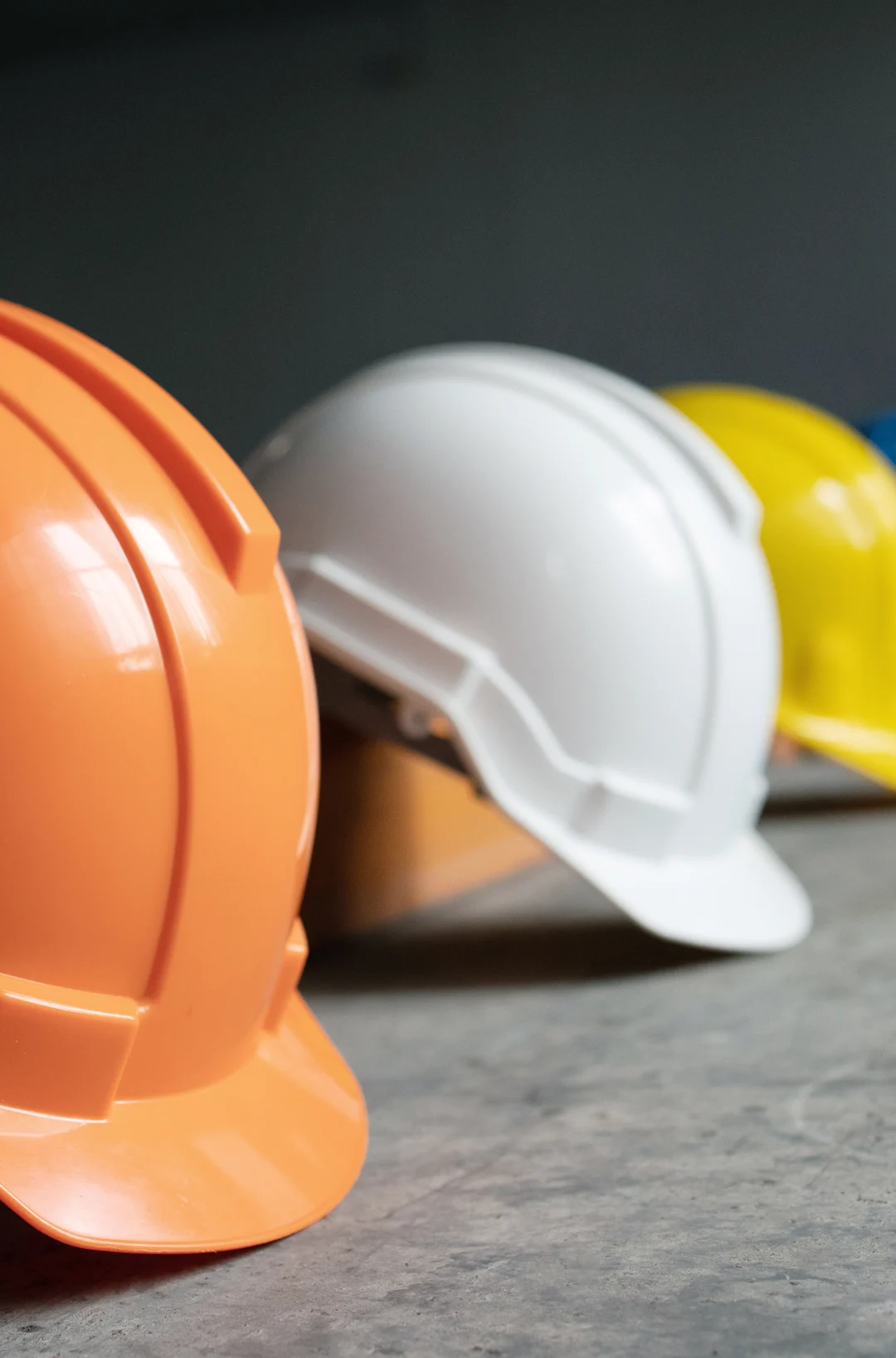 Row of brightly colored hard hats Row of brightly colored hard hats
