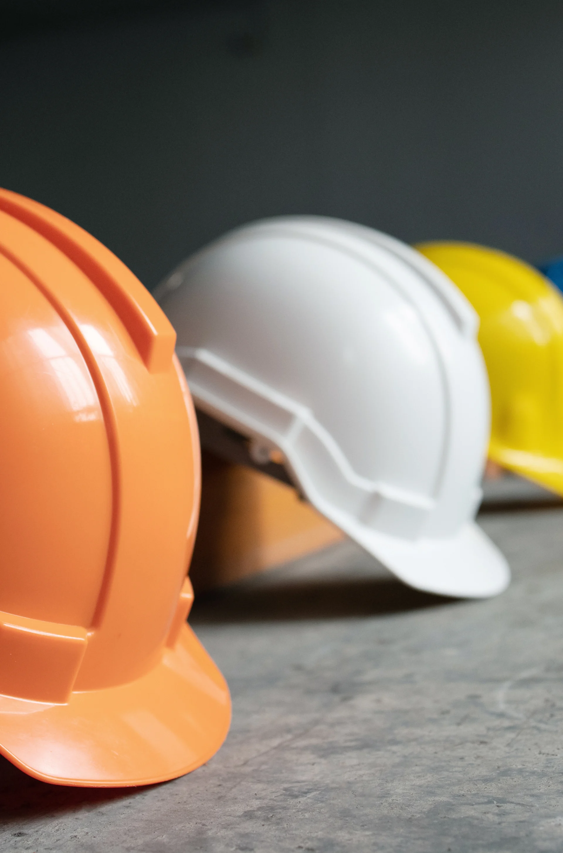 Row of brightly colored hard hats Row of brightly colored hard hats