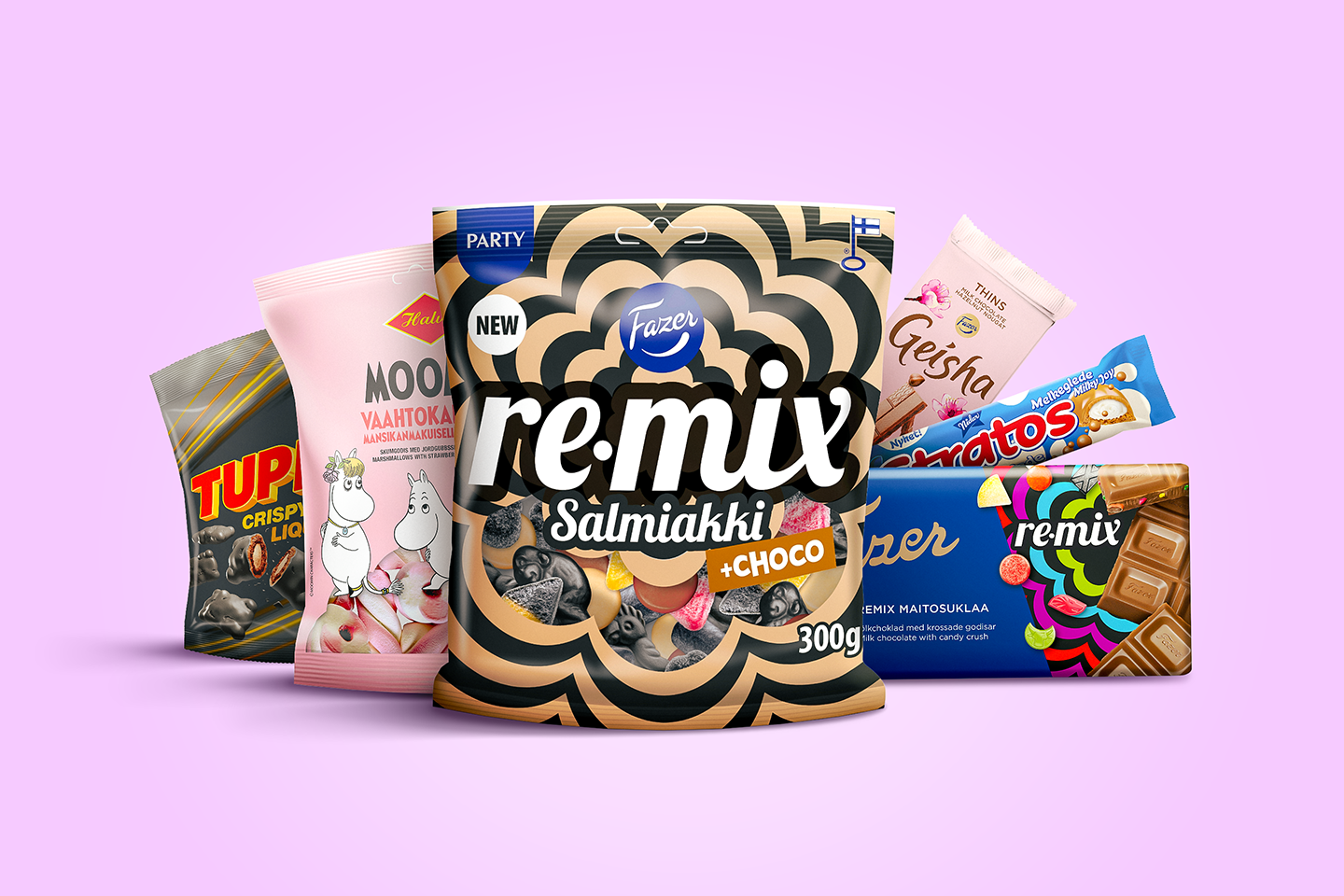 Fazerin herkkuvalikoima vaaleanpunaisella taustalla, keskellä uusi Remix Salmiakki+Choco -pussi ja ympärillä muita makeisia.