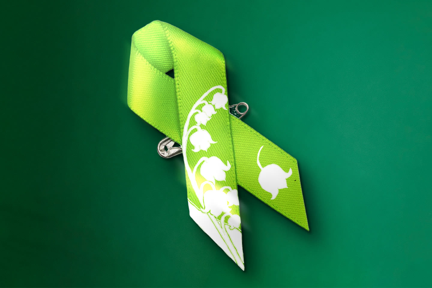 Kirkkaan vihreä rintanauha, jossa on valkoinen kielojen kuvio, vihreällä taustalla.