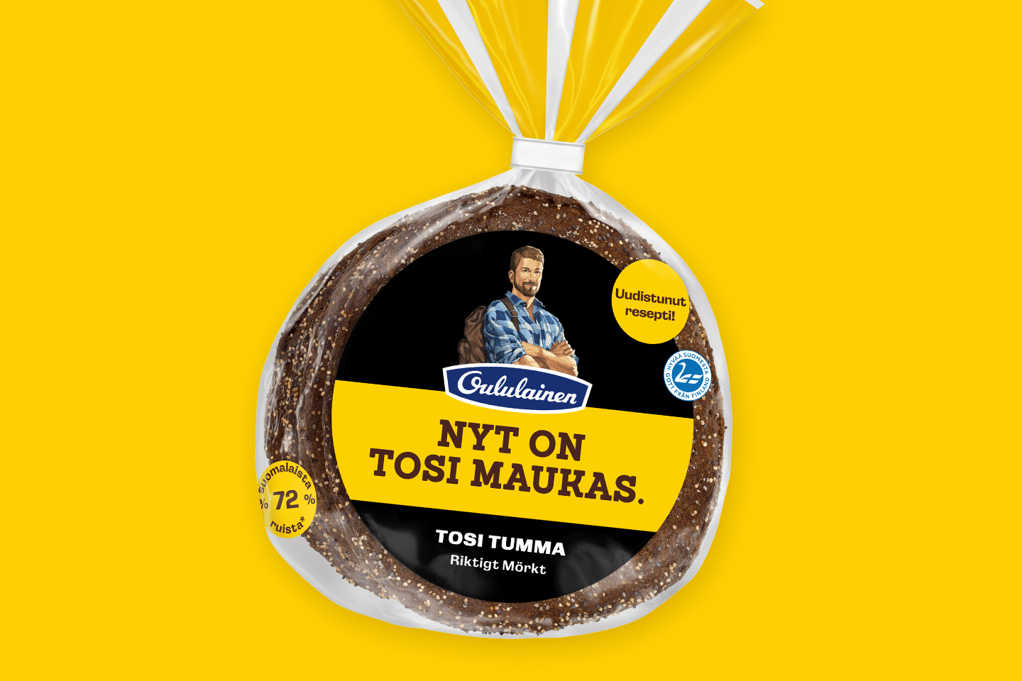 Oululaisen tumma leipäpakkaus keltaisella taustalla, jossa lukee "NYT ON TOSI MAUKAS" ja "TOSI TUMMA".