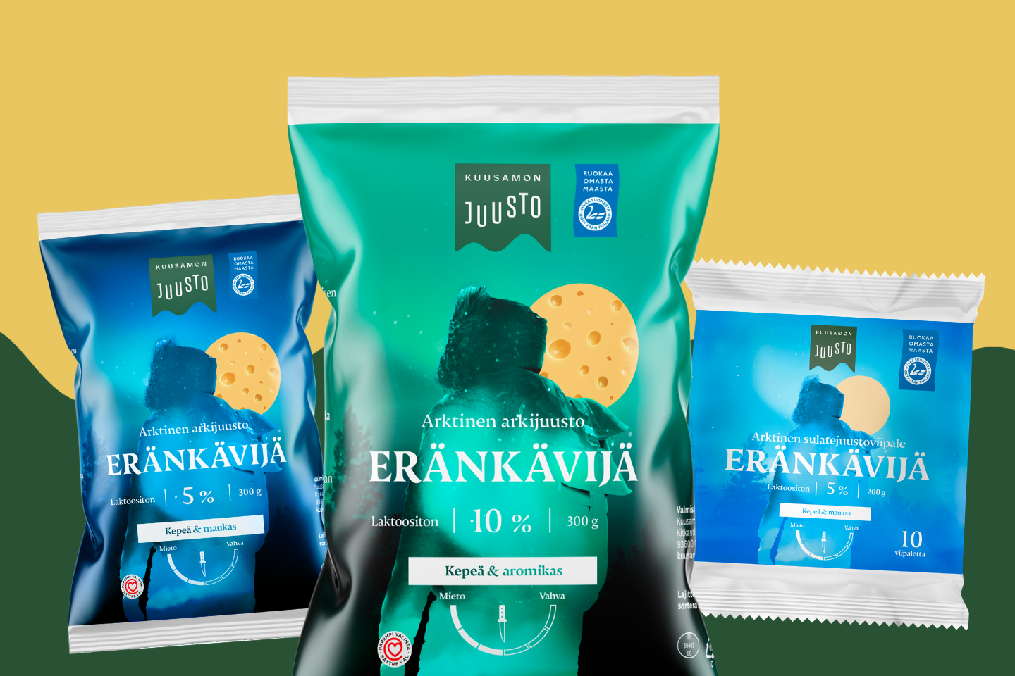 Kolme Kuusamon Juuston Eränkävijä-juustopakkausta: vihreä 300 g pakkaus, sininen 300 g pakkaus ja sininen sulatejuustoviipalepakkaus.