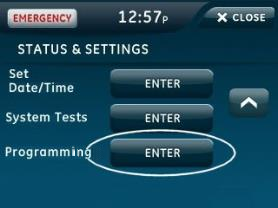 The Simon XTi panel Status and Settings screen with the Enter button next to Programming circled