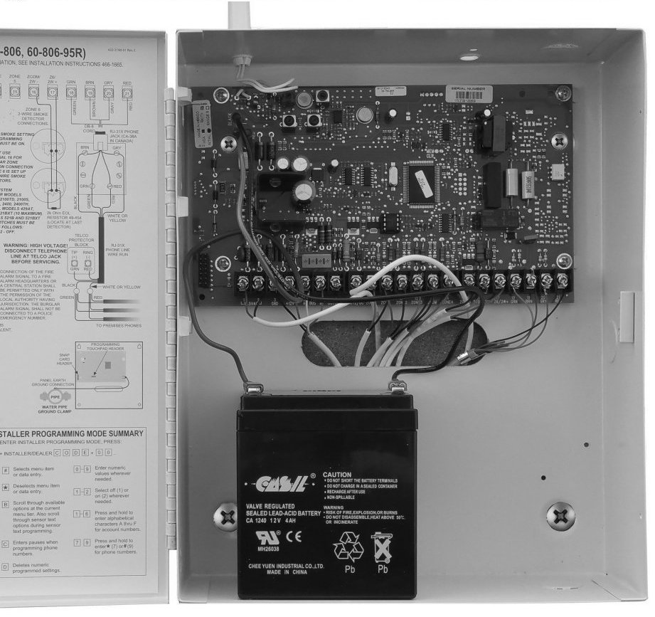 Picture of the Concord 4 panel box opened, with the backup battery at the bottom