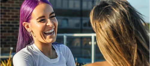 Woman laughing outdoors