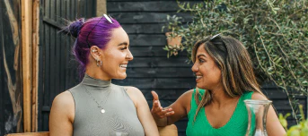 Woman laughing outdoors