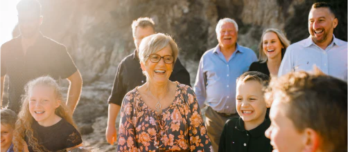 Group of people standing smiling and laughing