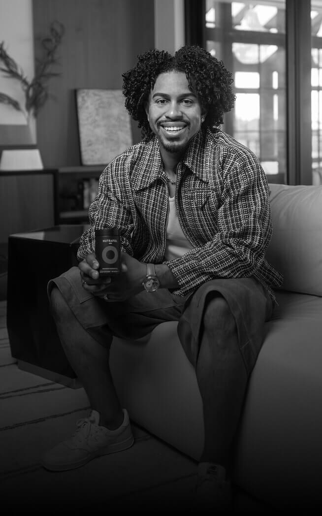 Francisco Lindor holding a Nutrafol Men bottle.
