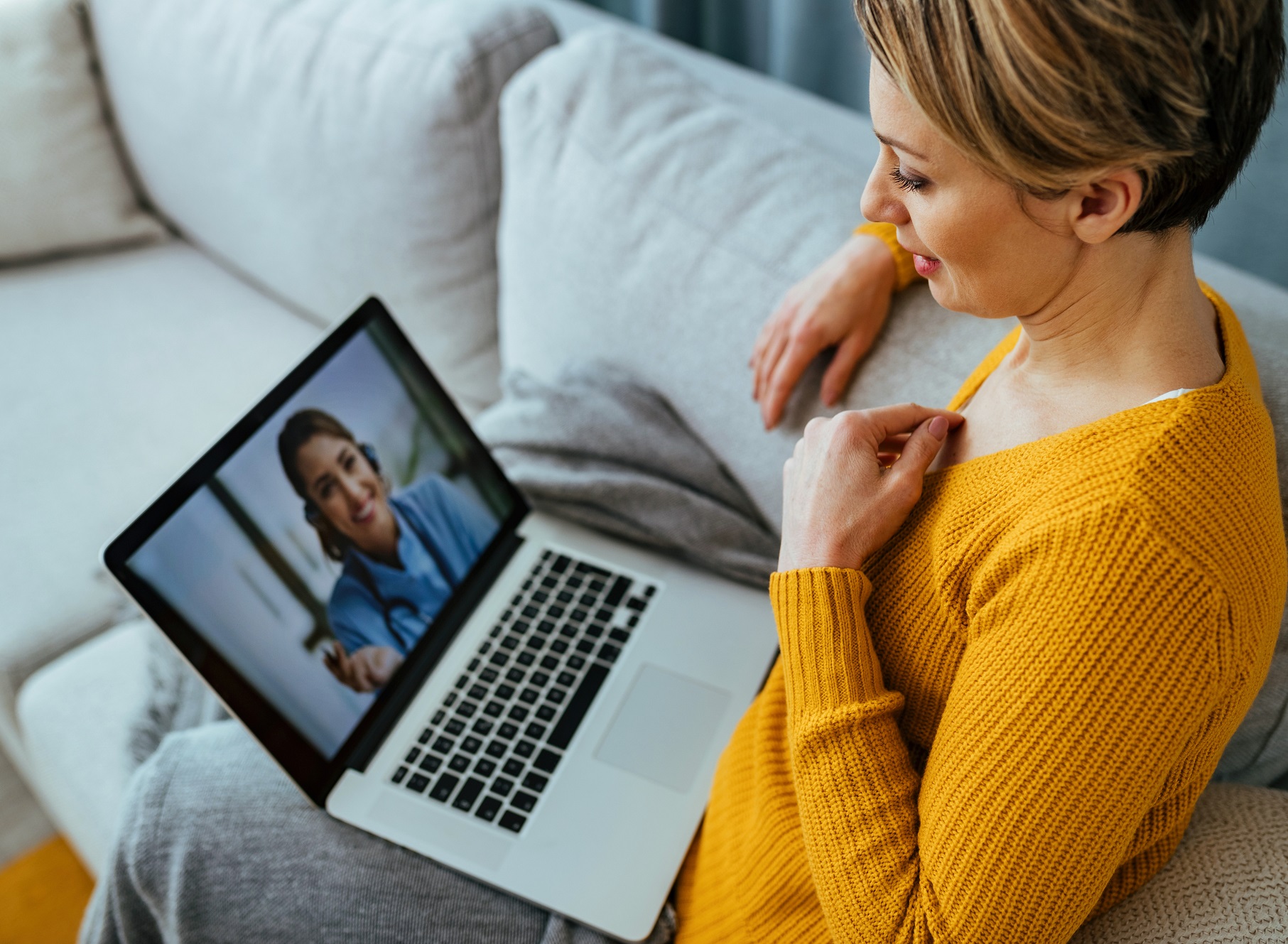 Patient uses telehealth to communicate with her caregiver.