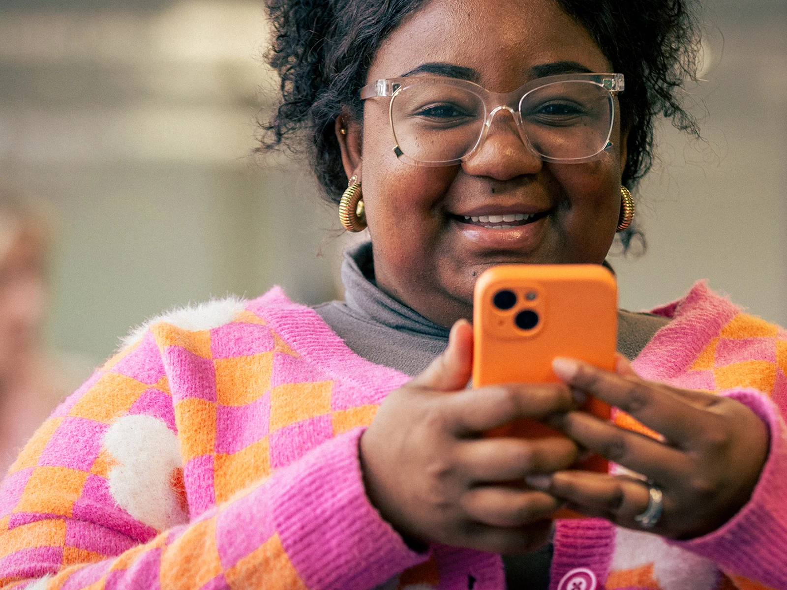 Mobile phone user staying connected through calls, messages and mobile internet services.