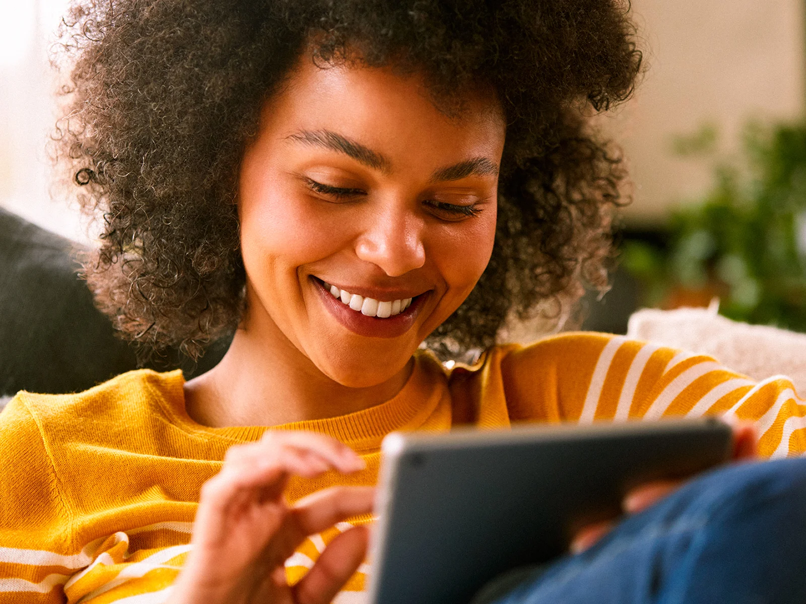 Customer enjoying fast and reliable full fibre broadband at home with Utility Warehouse's 6 months free broadband offer for eligible customers.
