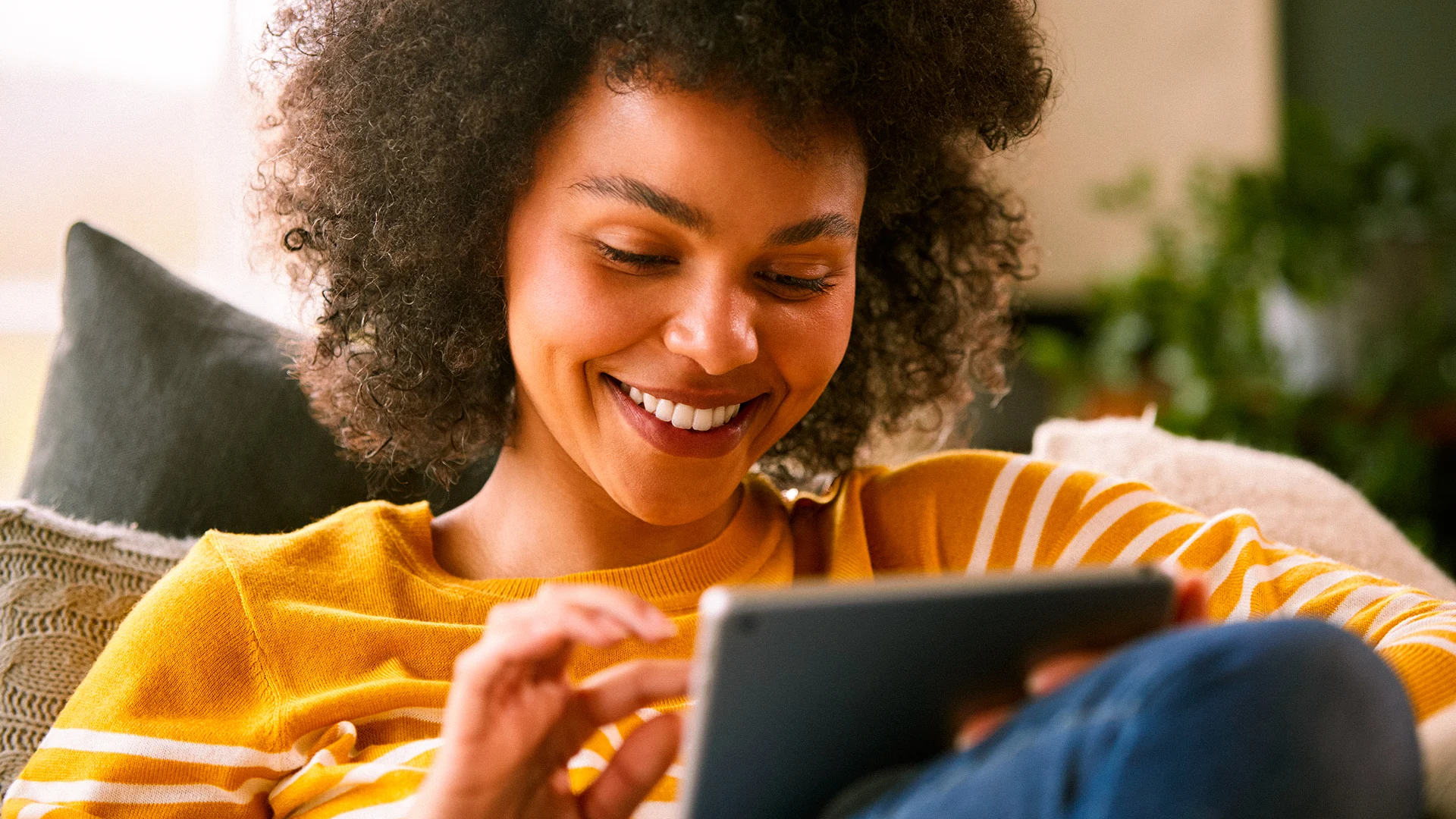 Customer enjoying fast and reliable full fibre broadband at home with Utility Warehouse's 6 months free broadband offer for eligible customers.