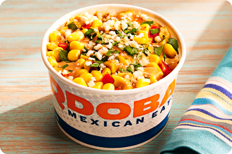 Mexican Street Corn is available as a delicious topping to your next dish! Made with warm corn & creamy elote sauce, it’s the perfect topping on any meal. Order today at QDOBA Mexican Eats.