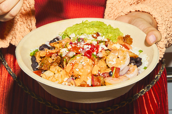 Surf & Turf is Back at Qdoba Mexican Eats! Double the protein, double the flavor with Citrus Lime Shrimp and flame-grilled steak, hand-crafted guacamole, chile crema, pico de gallo, cotija cheese, cilantro lime rice and black beans served in a bowl.