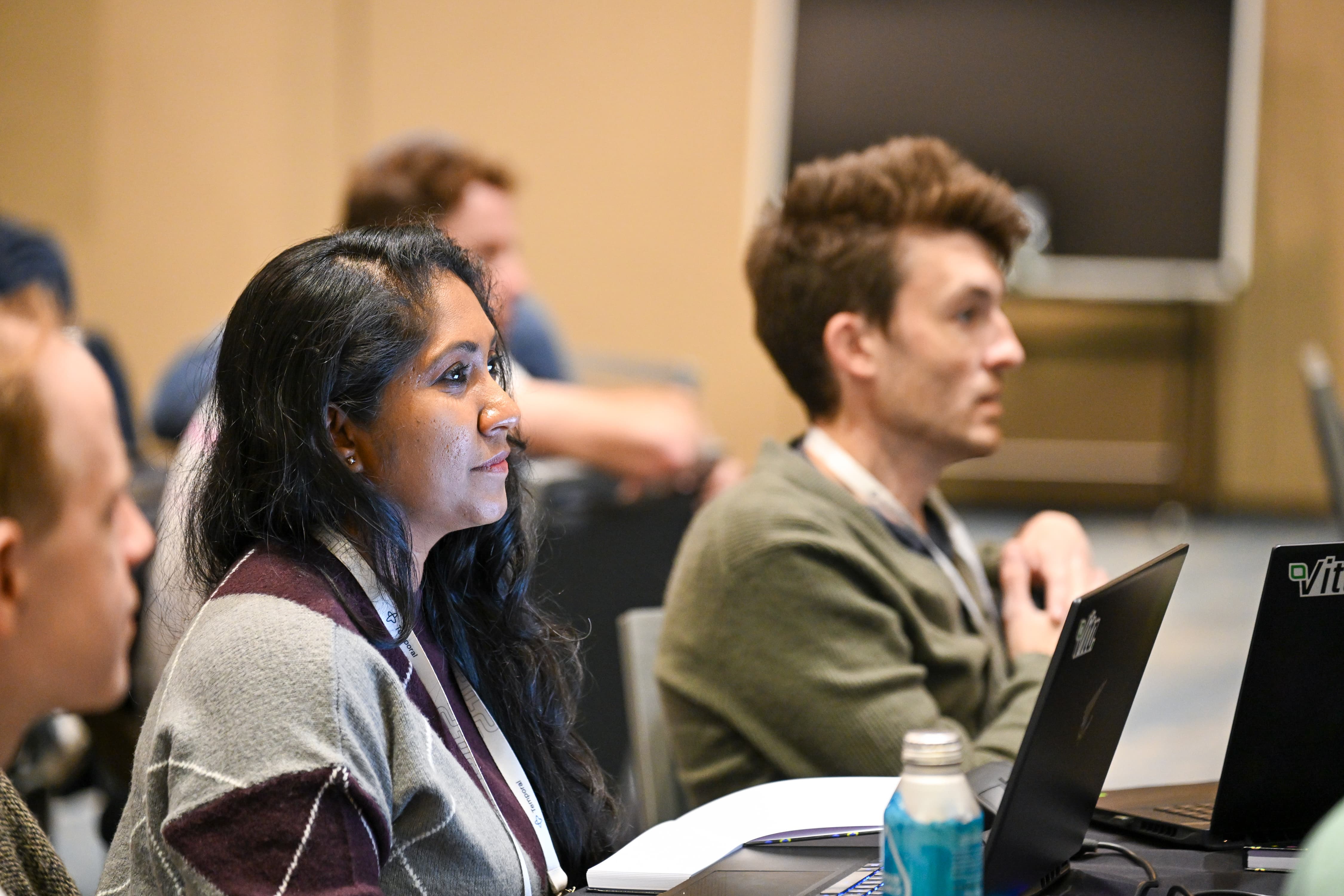 A Replay 2026 attendee watching a presentation