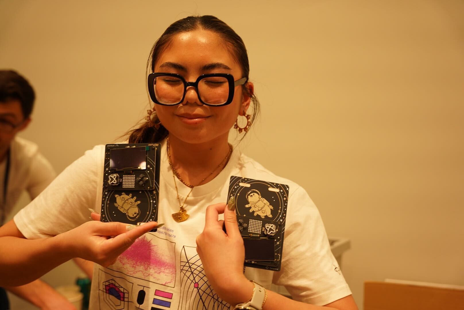 Melissa Herrera holding finalized Replay badges