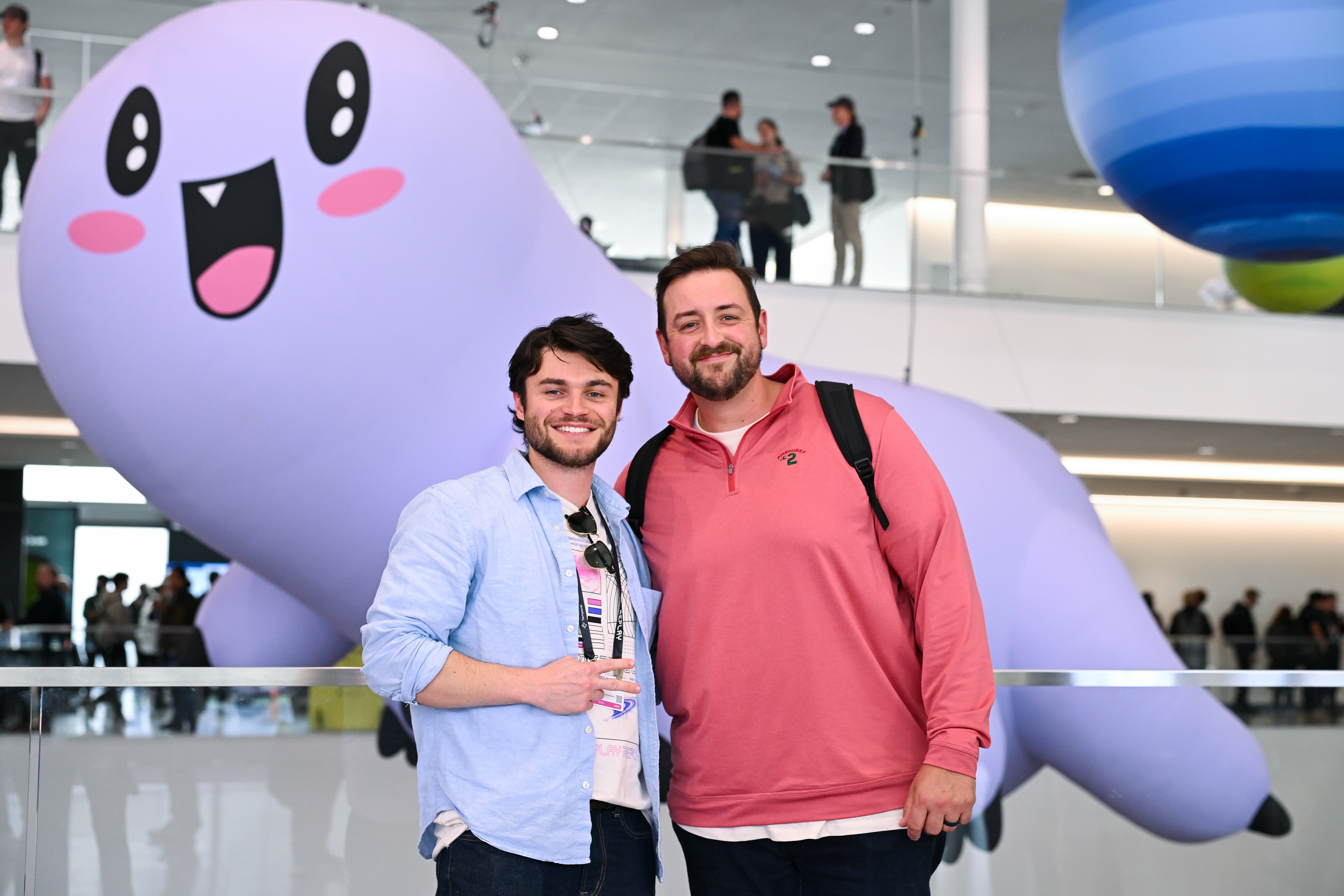 Replay 2026 attendees posing in front of a giant Ziggy