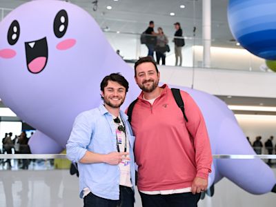 Replay 2026 attendees posing in front of a giant Ziggy