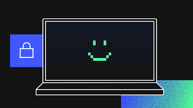 Laptop displaying a pixelated green smiley face on dark screen with a blue padlock icon in corner on black background