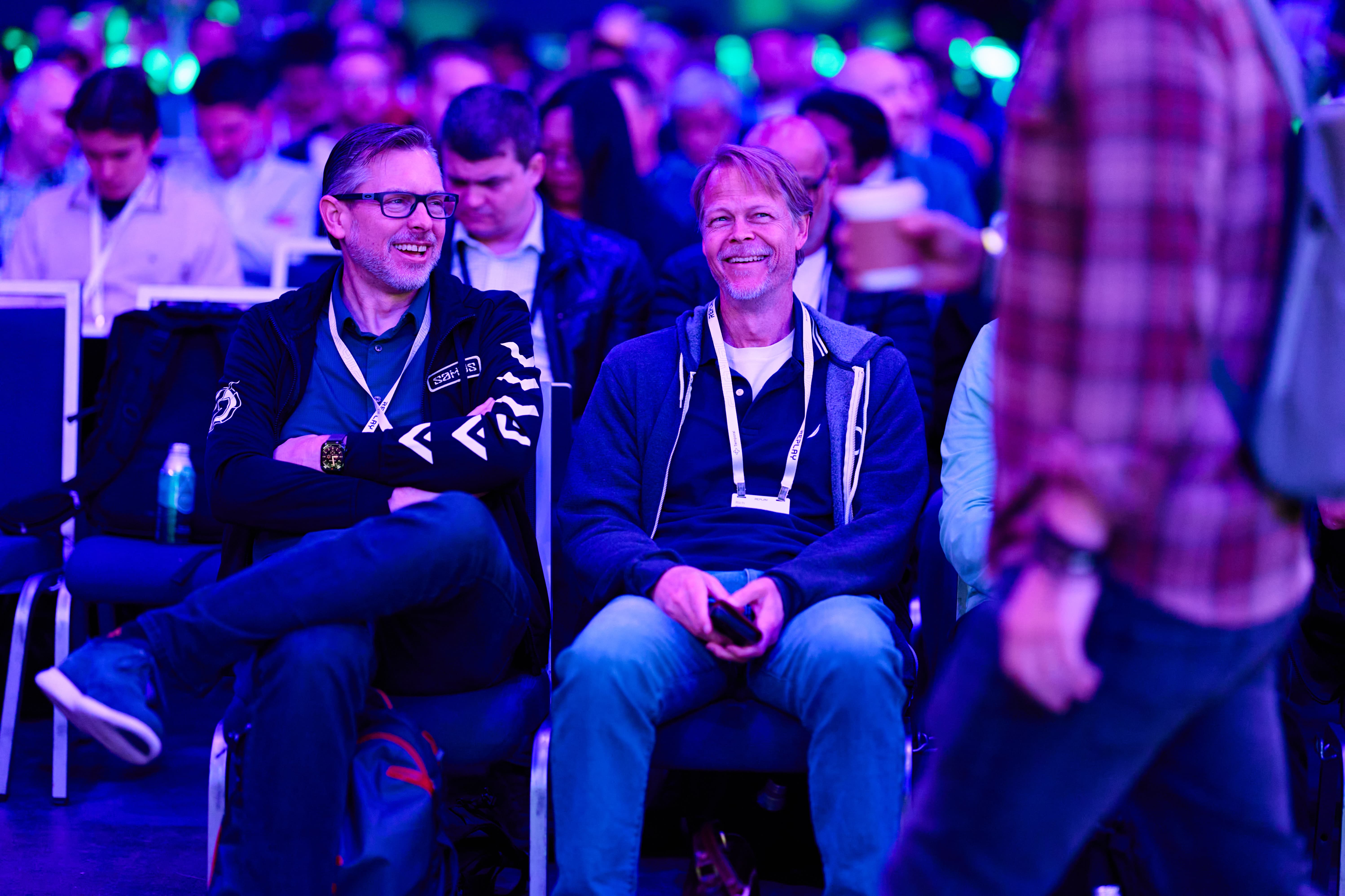 Two Replay 2026 attendees smiling before keynote