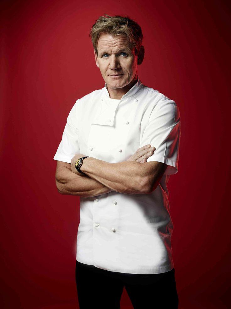 Gordon Ramsay in a white chef's jacket, arms crossed, staring down the camera against a red backdrop