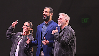 Two Temporal staff members posing with CEO Samar Abbas during the Replay 2026 keynote