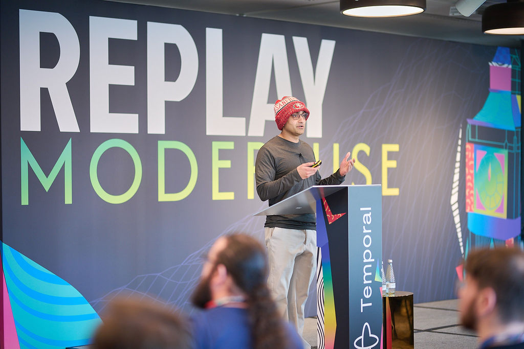 Manu from Temporal speaking at Replay 2025