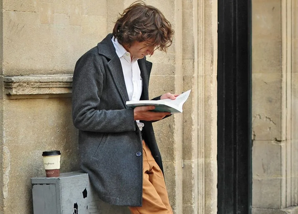 Man leaning on wall