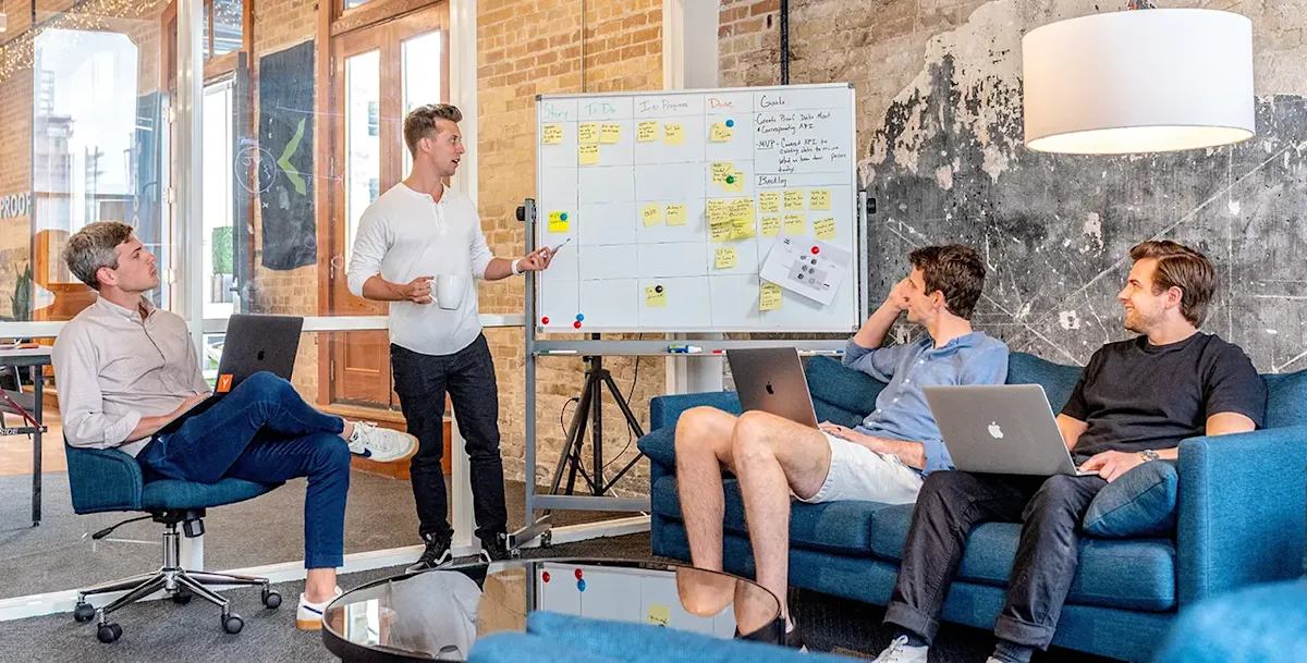 Team meeting around a whiteboard
