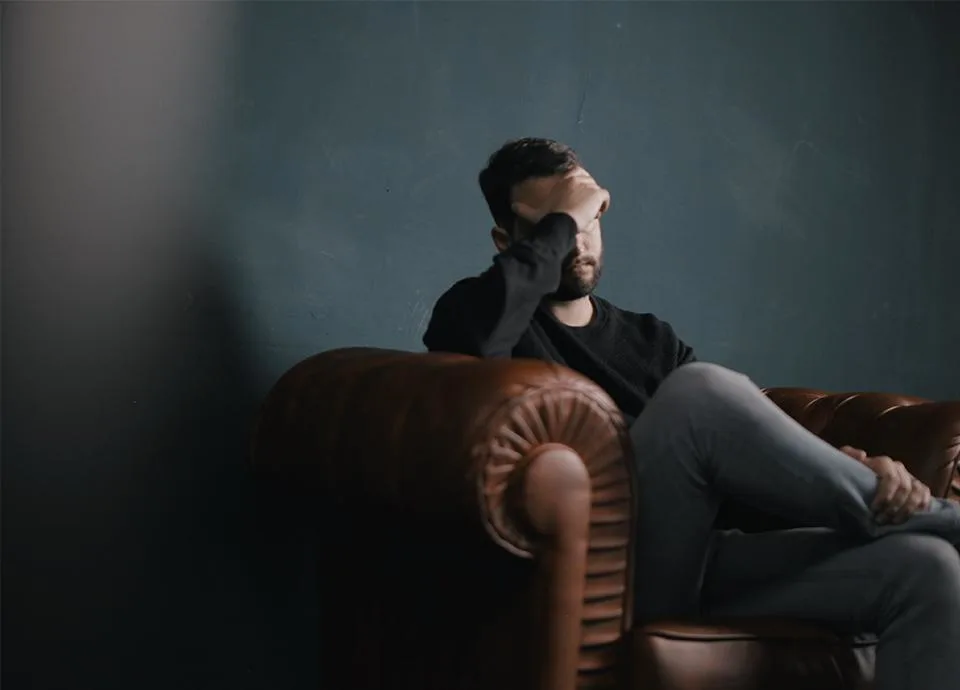Exasperated man on couch