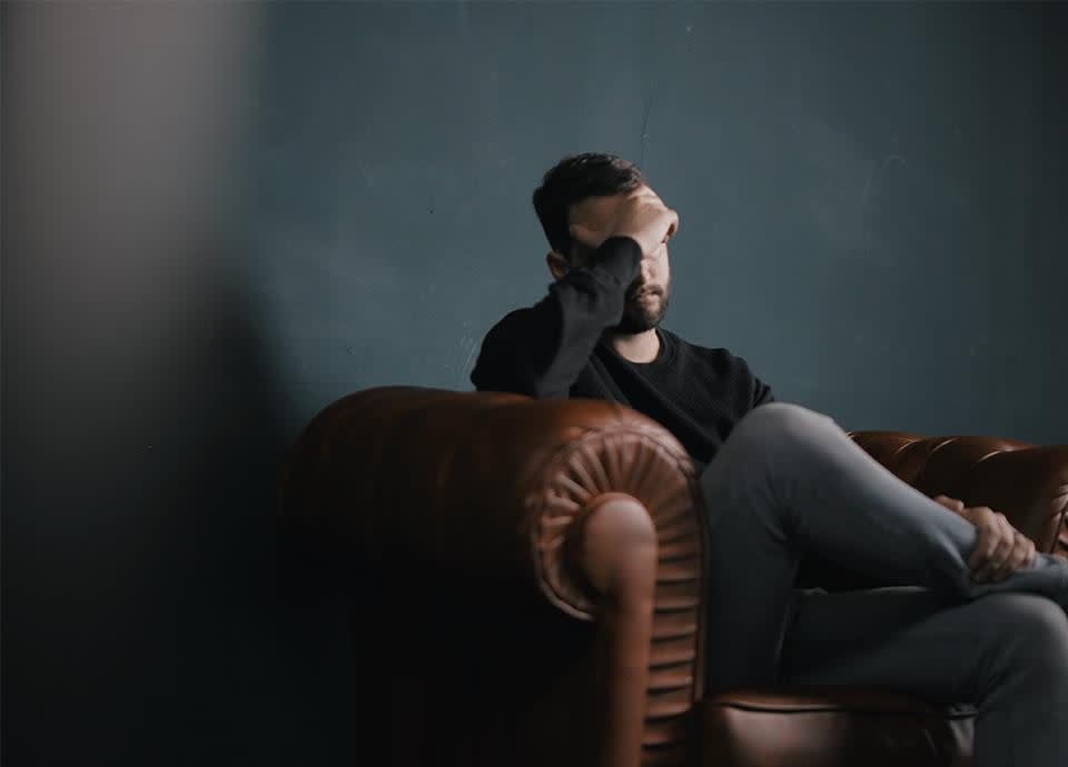 Exasperated man on couch