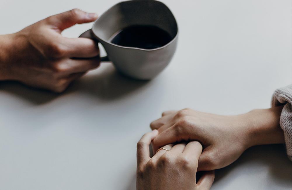 Hands at a table