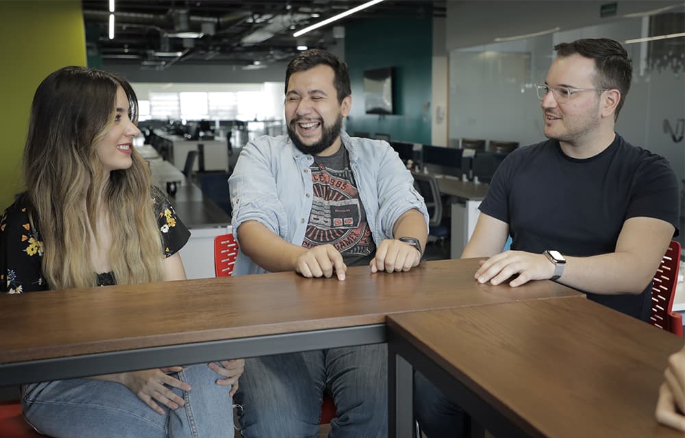 Three Improvers Laughing in Breakroom