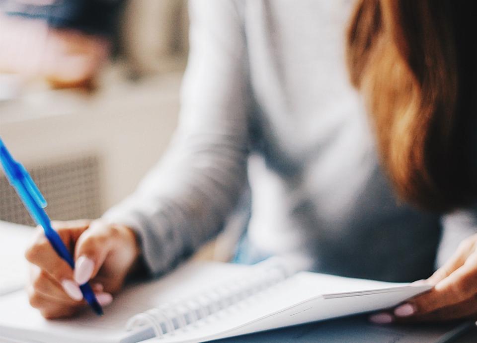 Woman writing in her notebook