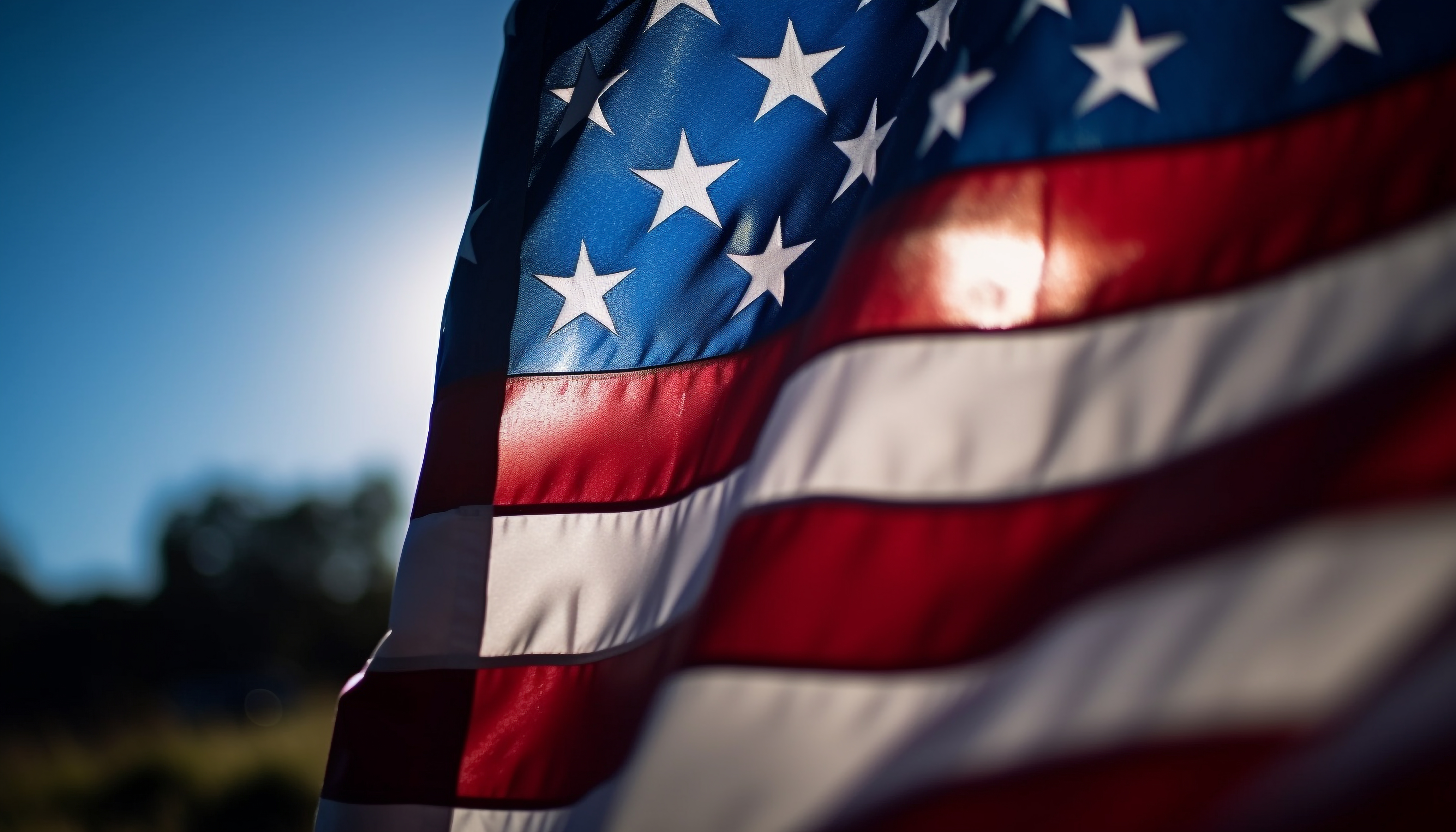 American veteran honors flag at sunset celebration