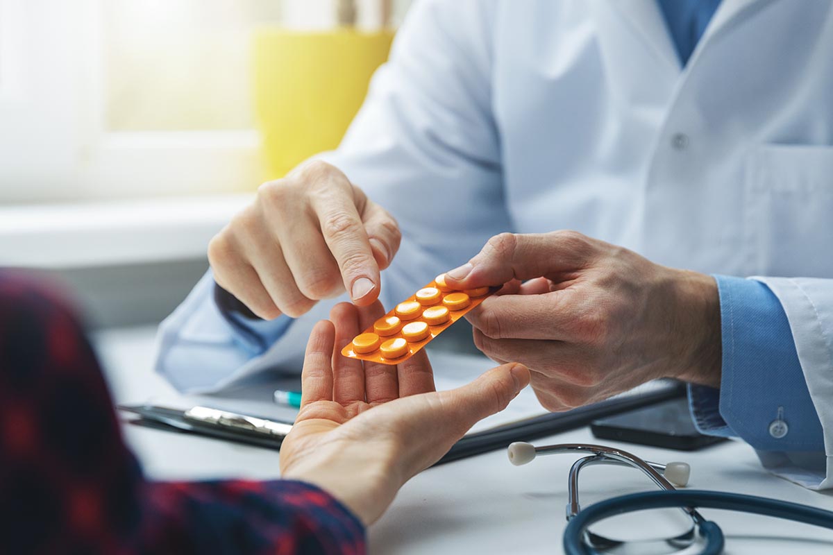 Doctor providing meds to a patient 