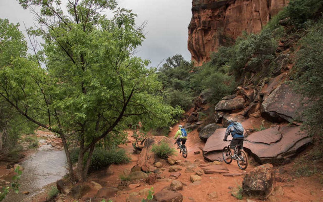 Red Rock Region | Photo Gallery | 1 - Snow Canyon State Park Volcanic basalt spewed from the depths of hell into the lap of a sandstone canyon. Great biking and hiking.