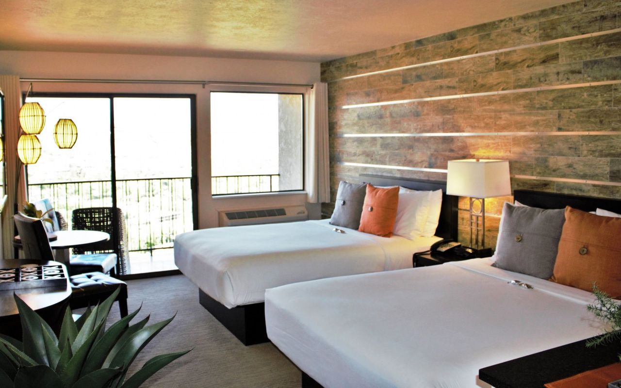 Inn on the Cliff | Photo Gallery | 4 - Double Queen Unwind on one of our popular Simmons Beautyrest Queen Size Mattresses. Each room has two queen beds to comfortably accommodate up to four guests.