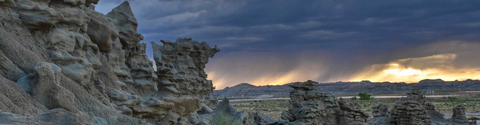 Terms of Use Banner - An image of a scenic Utah landscape with large gray formations