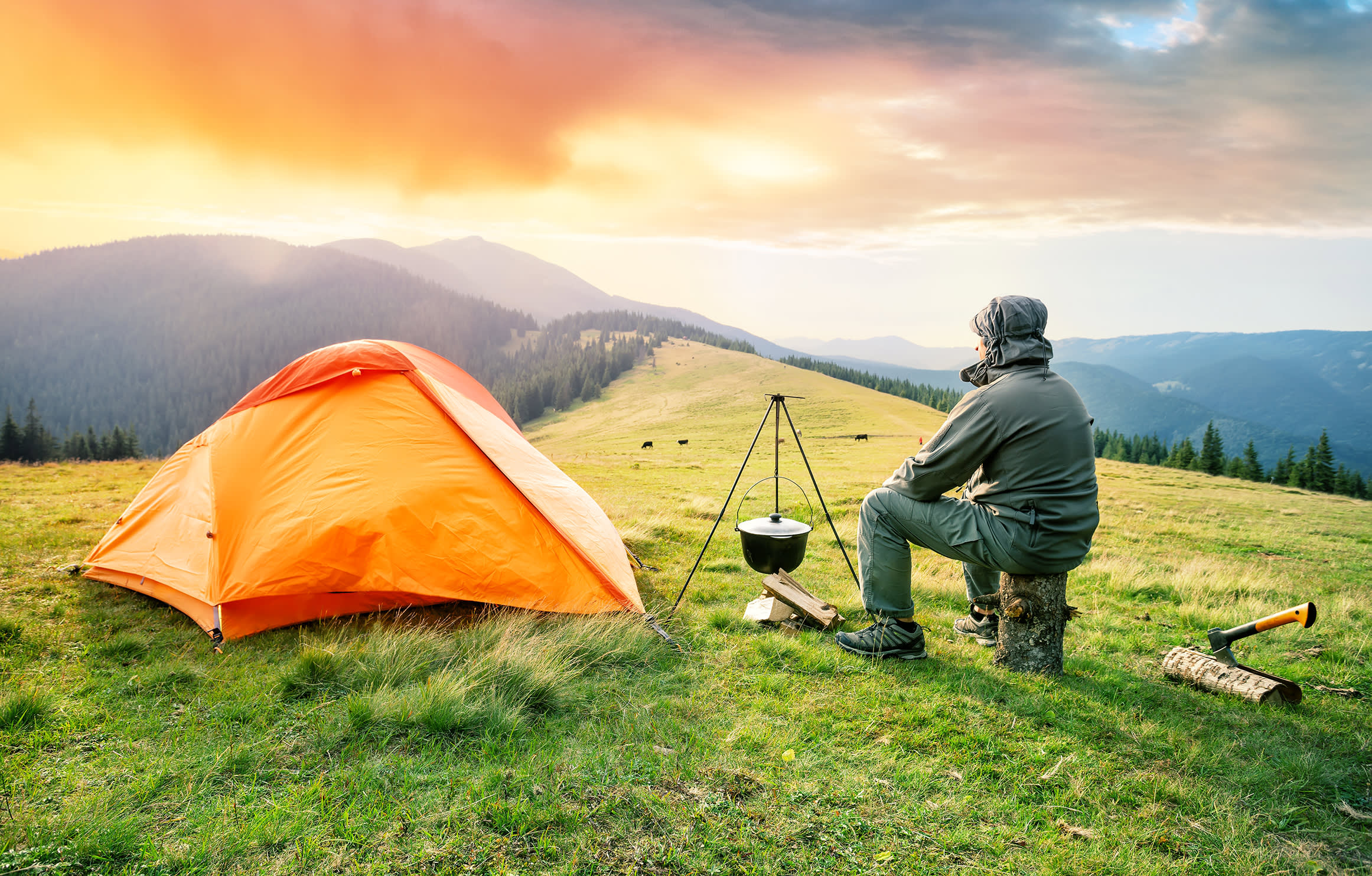 Person Camping looking at mountains - Person Camping looking at mountains