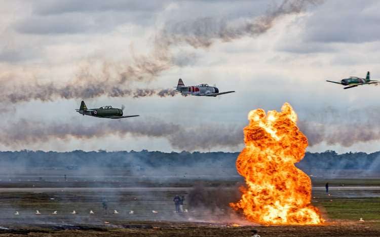 TORA.jpeg - Pilots from the Tora Tora Tora airshow team use pyrotechnics to reenact the Japanese attack on Pearl Harbor.