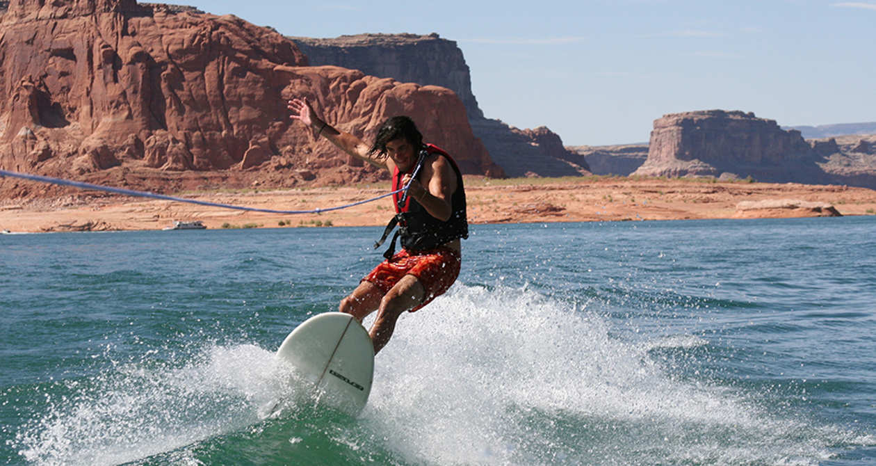 Recreation Areas | Photo Gallery | 1 - Person wake surfing in Lake Powell Utah