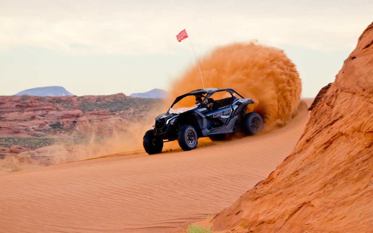 St. George (Greater Zion) | Photo Gallery | 8 - Side by side driving through sand at Sand Hollow state park