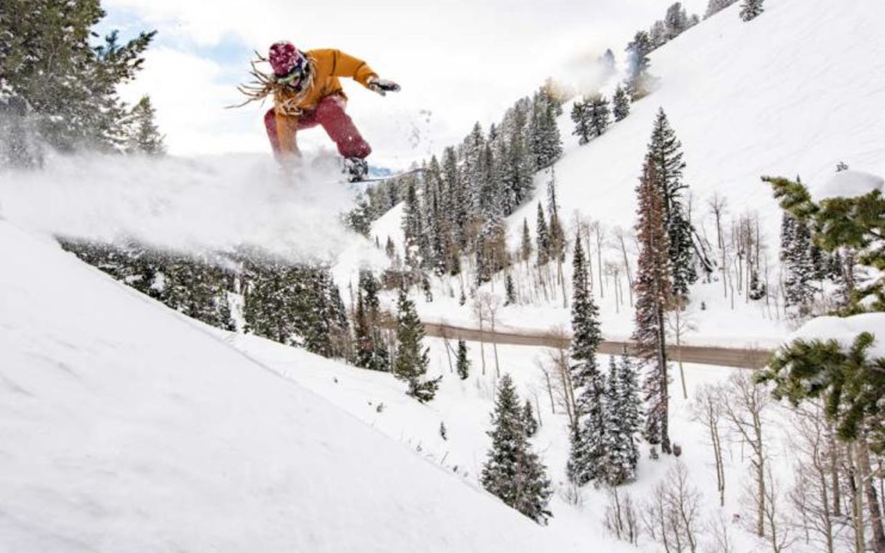 Ogden | Photo Gallery | 10 - Snowboarder jumping down a steep slope