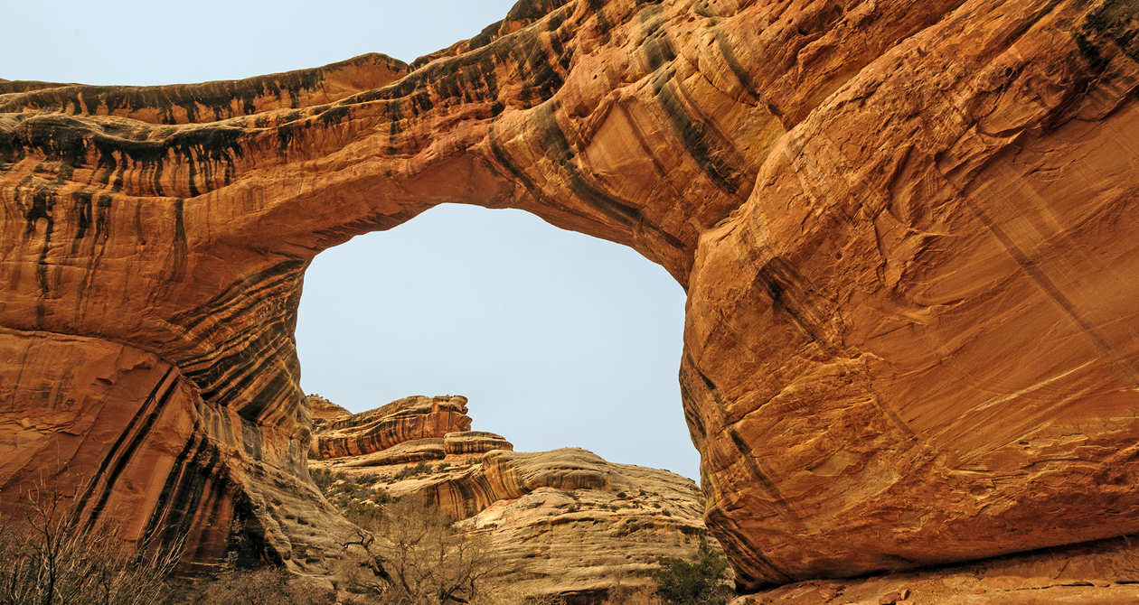Natural Bridges | Photo Gallery | 1 -  Three massive arches in a tiny 10-mile loop. Bring your hiking shoes and your camera and spend some time thinking up bridge metaphors that will solve our current divisive politics.